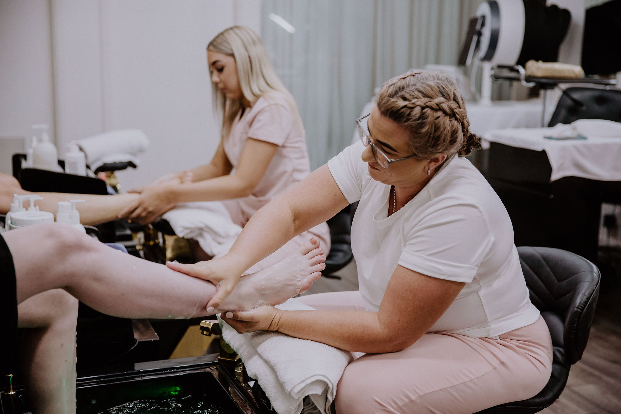 Staff member with a client during a Manicure and Pedicure Appointment