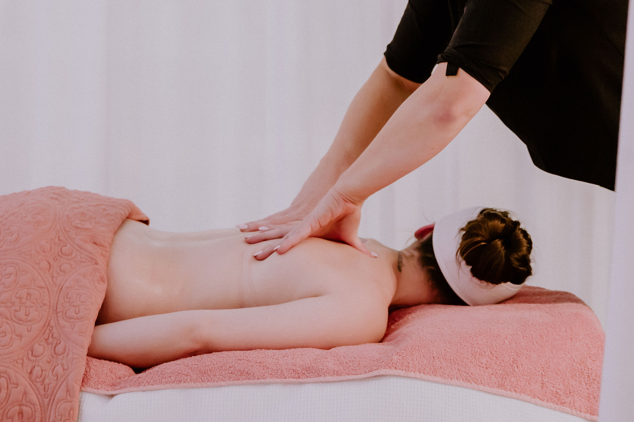 Staff member with a client during a Massage Appointment